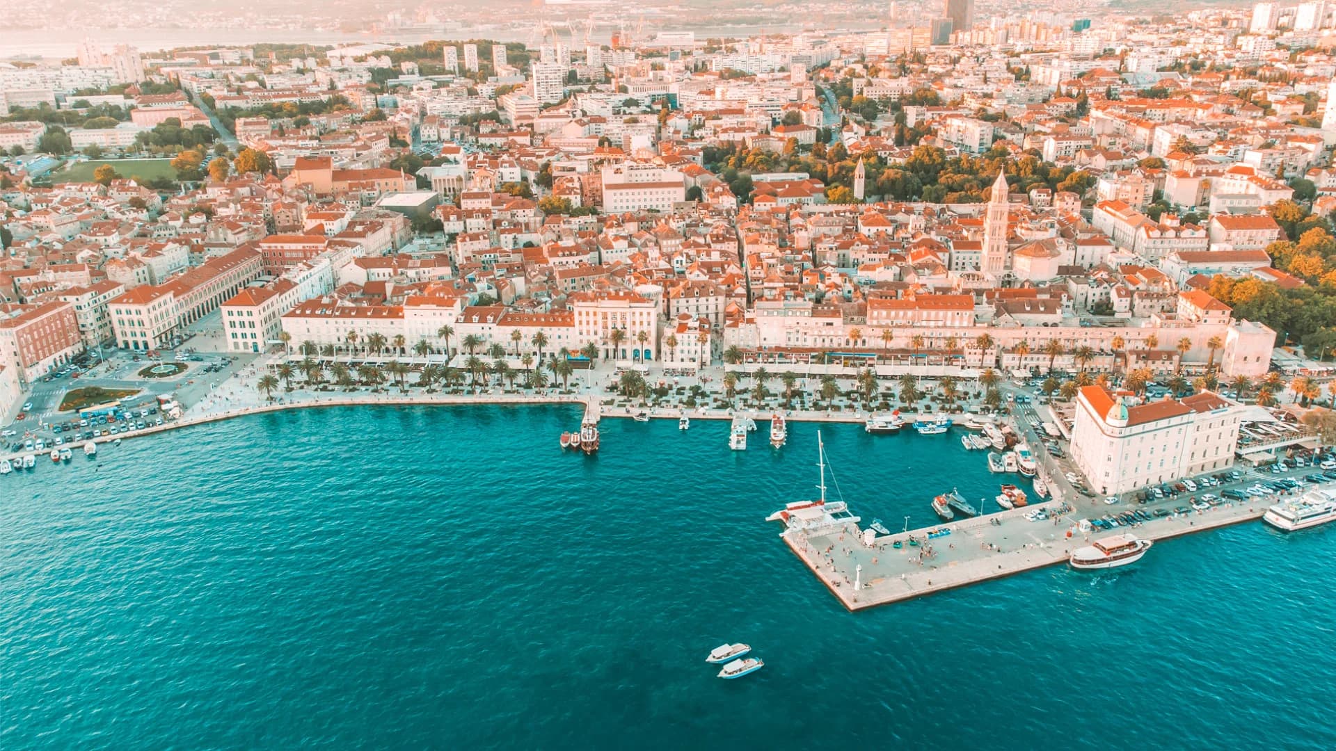 Split's Riva promenade and the Diocletian's Palace bell tower from the air, where the tour departs (Blå Grottan – 5-ö-turen)